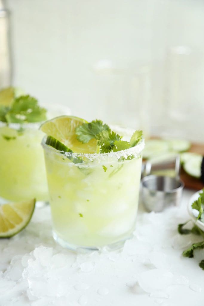 Cucumber and Cilantro Margarita in a small glass with salt.