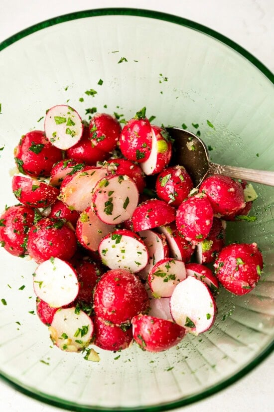 toss radishes in a bowl with oil and seasoning