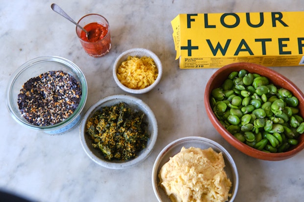 ingredients for citron noodles including spaghetti, fava beans, zest, chili crisp and furikake