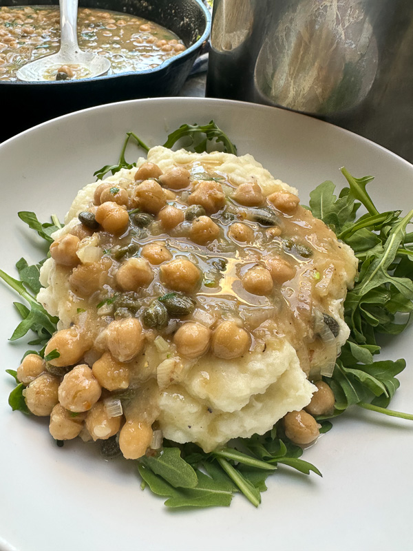 Bright, bold, and comforting—Shutterbean’s Chickpea Piccata is served over creamy mashed potatoes with a generous handful of peppery arugula. A fast, flavorful, plant-based dinner loaded with lemon, garlic, and capers. Perfect for a cozy weeknight meal that feels like a restaurant dish.