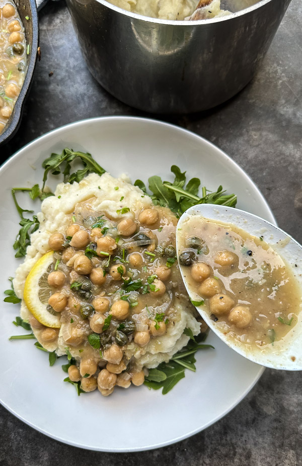 Bright, bold, and comforting—Shutterbean’s Chickpea Piccata is served over creamy mashed potatoes with a generous handful of peppery arugula. A fast, flavorful, plant-based dinner loaded with lemon, garlic, and capers. Perfect for a cozy weeknight meal that feels like a restaurant dish.